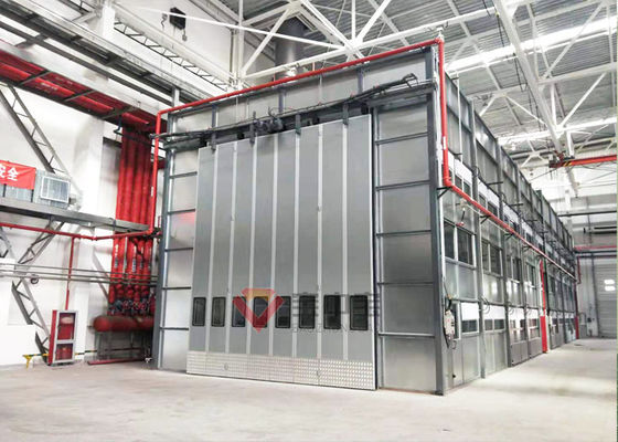 Các gian hàng sơn công nghiệp lớn với phòng sơn có người nâng để sơn máy móc hạng nặng
